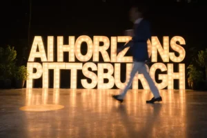 Ai Horizons in Pittsburgh in gold lighting with person walking across