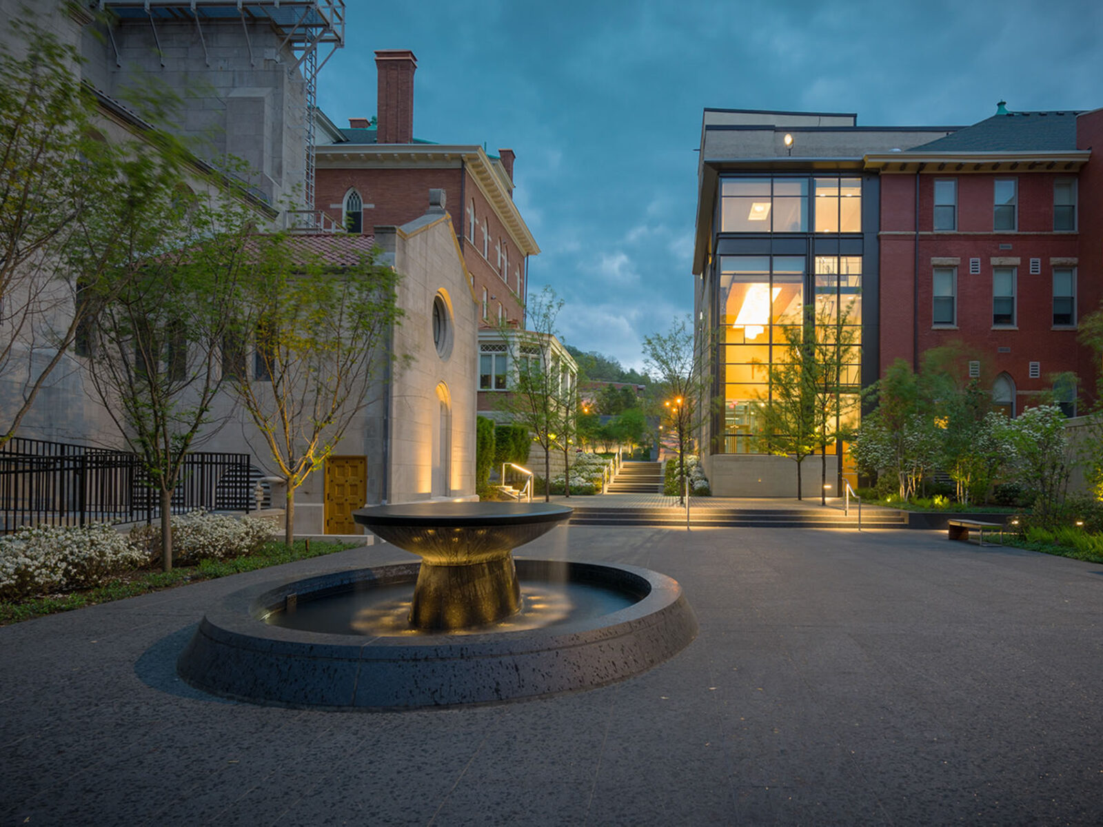Courtyard at night with a fountain in center